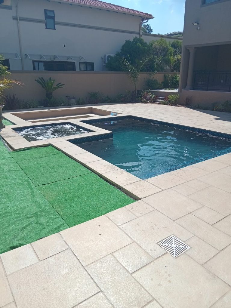 The restored pool with a smooth new finish and clean coping