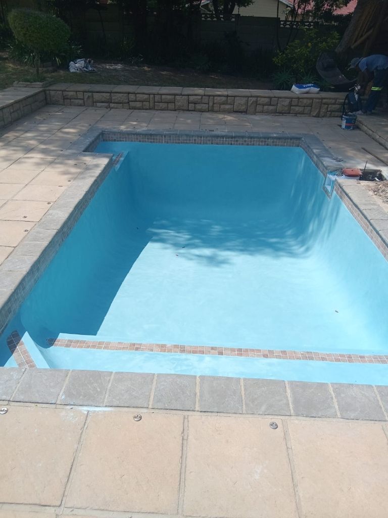 Cracked and weathered pool interior before restoration