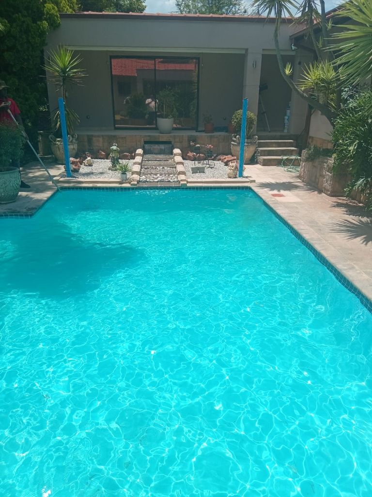 Pool technician servicing pump and filtration equipment